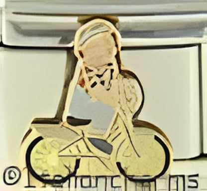 Raggedy Andy Riding a Bicycle