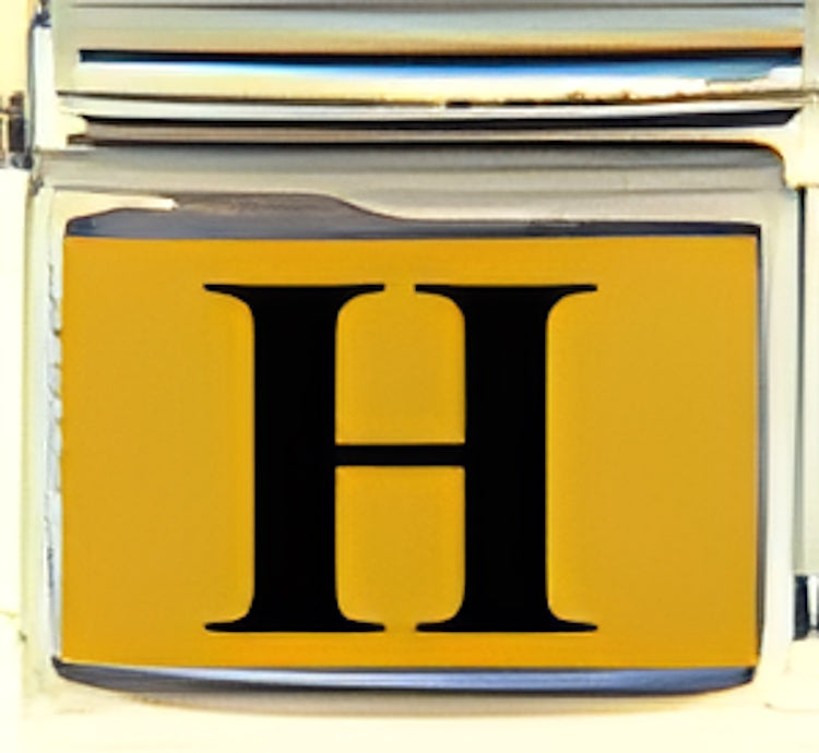 Black Times Letter H with Gold Colored Background Photo Charm